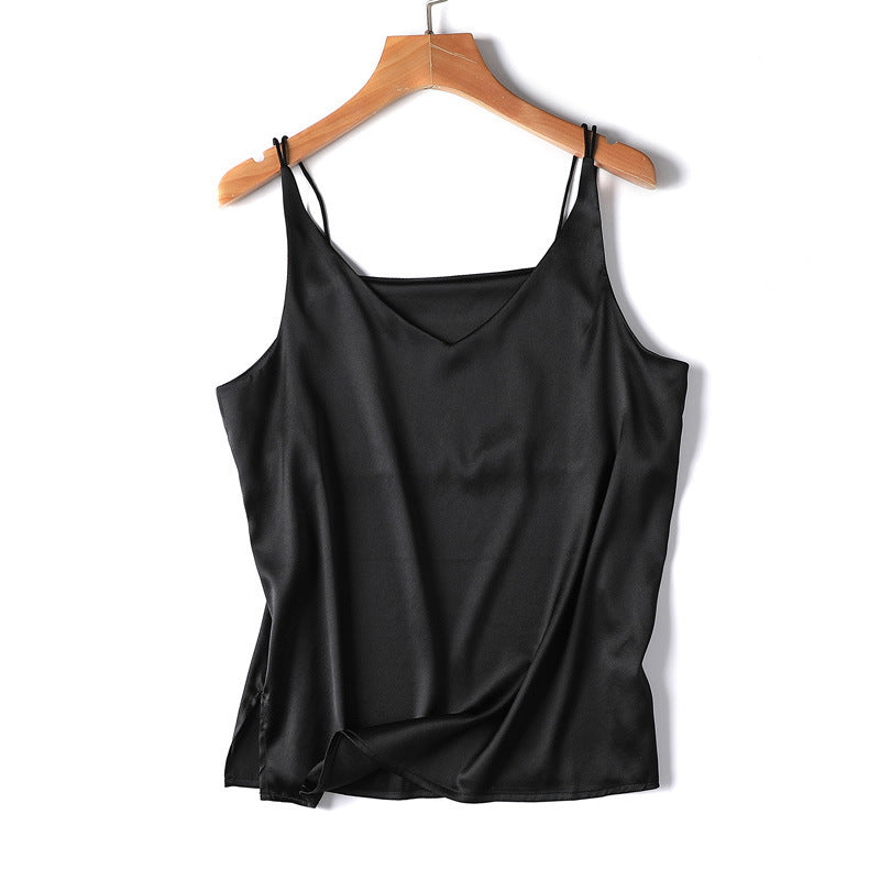 Black satin camisole on a wooden hanger against a white background
