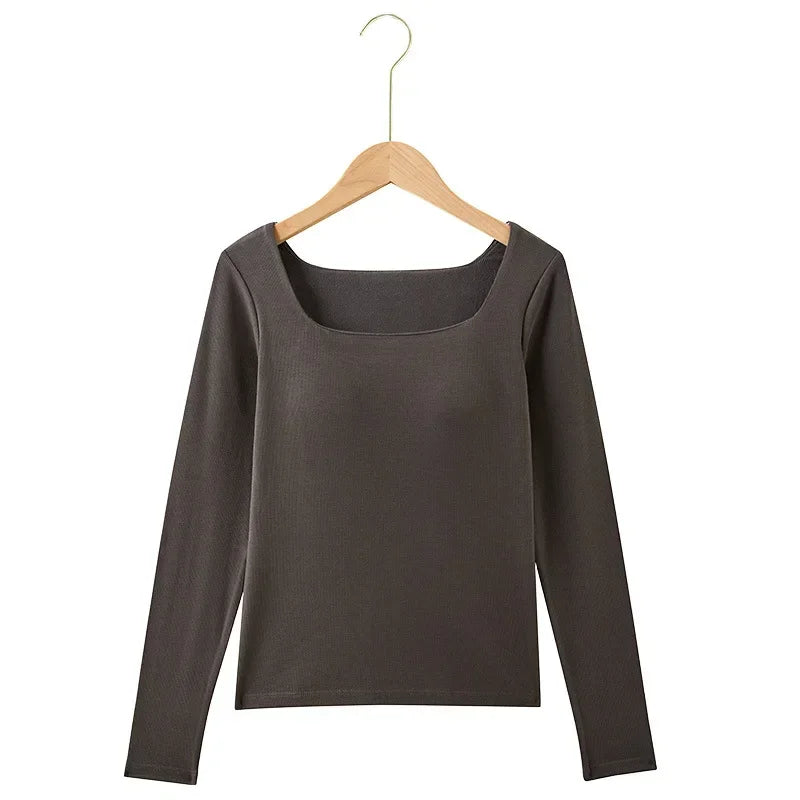 Gray long-sleeve shirt on a wooden hanger against a white background