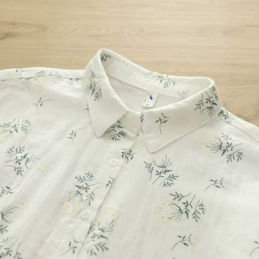 White shirt with floral pattern on a wooden surface