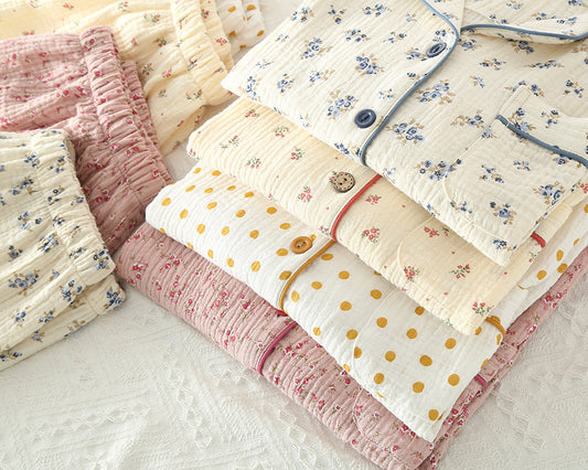 Collection of floral and polka dot women pyjamas on a light background