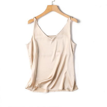 Beige satin slip top on a wooden hanger against a white background