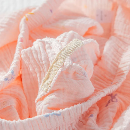 Close-up of pink textured fabric with a floral pattern