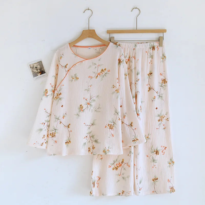Floral pajama set on hangers against a white background