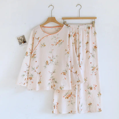 Floral pajama set on hangers against a white background