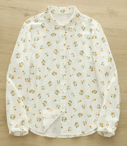 White blouse with small floral pattern on a wooden surface