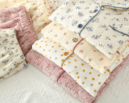 Collection of floral and polka dot women pyjamas on a light background